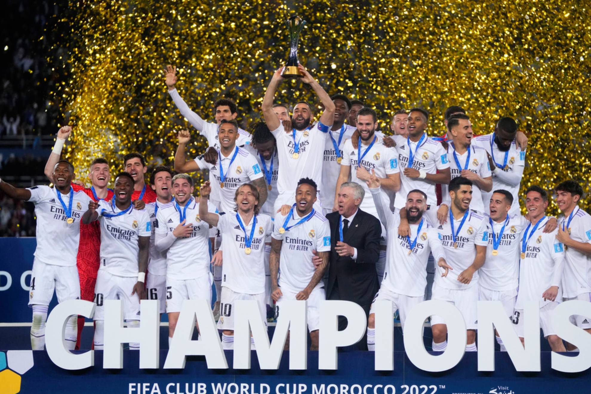 Real Madrid players celebrate with the trophy after winning the FIFA Club World Cup